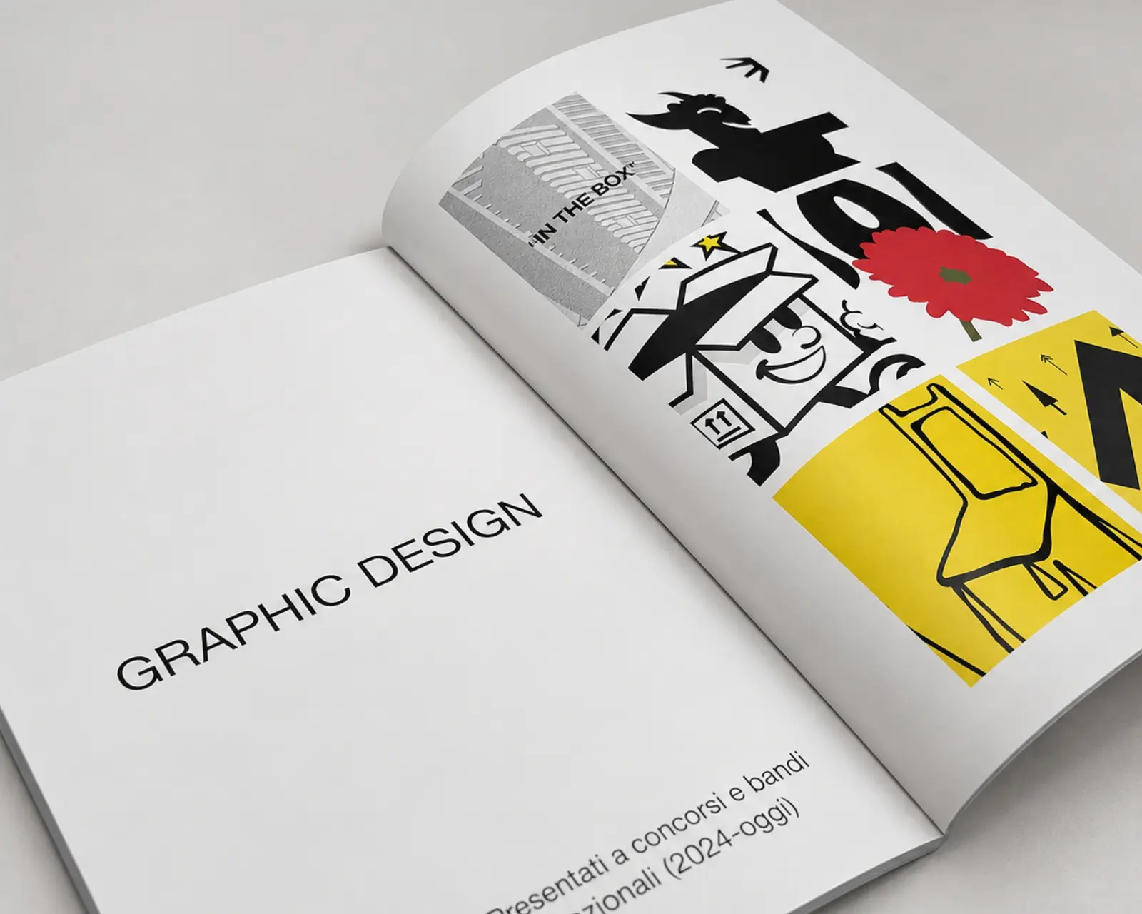 Rivista aperta sulla sezione Graphic design, con illustrazioni in nero, rosso e giallo